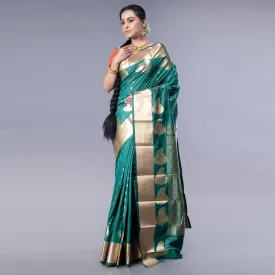 Women Kanjivaram Saree In Bottle Green Color With Golden Border And Booti